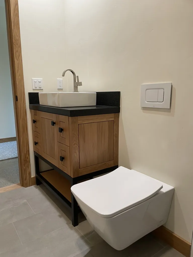 Modern bathroom vanity and wall-mount toilet installation